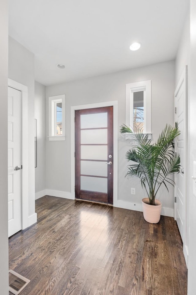 entrance foyer featuring dark hardwood / wood-style floors