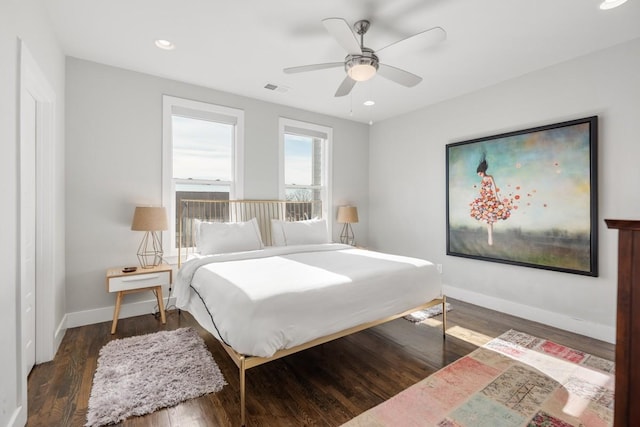 bedroom with dark wood-type flooring and ceiling fan