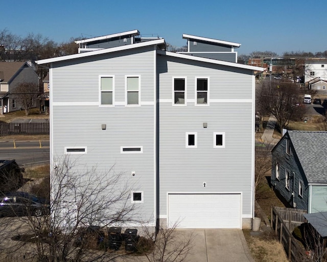 view of side of property featuring a garage