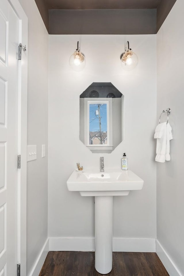 bathroom with hardwood / wood-style floors