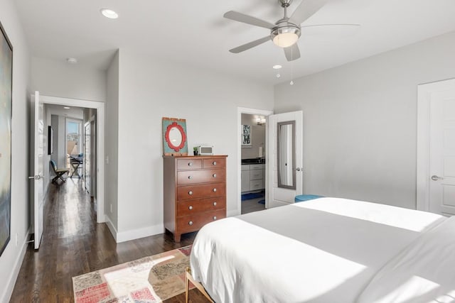 bedroom featuring ceiling fan and dark hardwood / wood-style floors