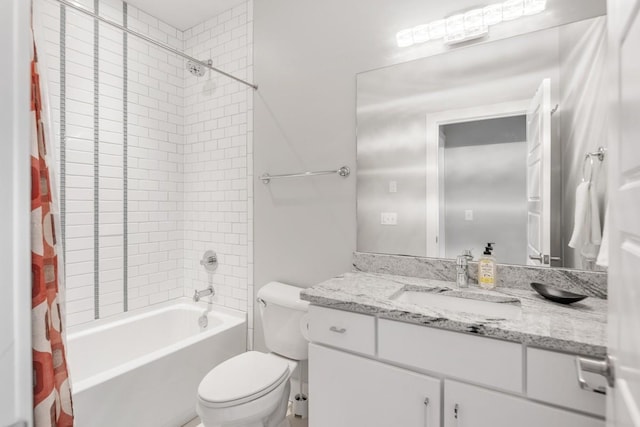 full bathroom featuring vanity, toilet, and shower / tub combo