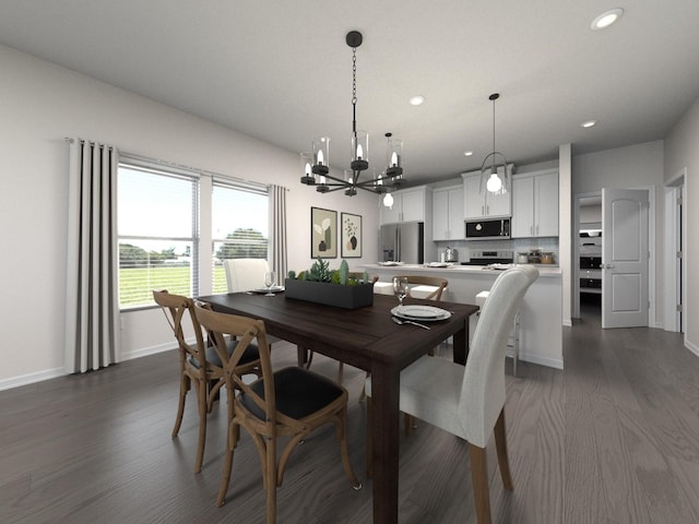 dining space with dark hardwood / wood-style flooring and an inviting chandelier