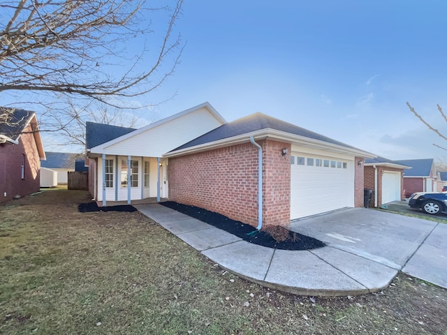 ranch-style home with a porch, a garage, and a front yard