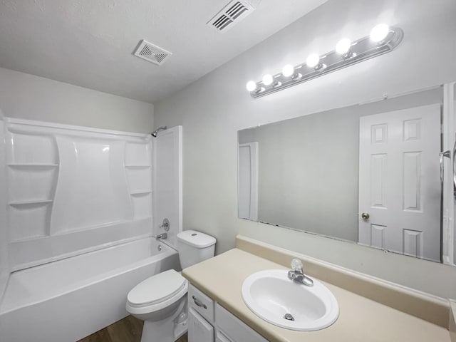 full bathroom featuring washtub / shower combination, vanity, toilet, and hardwood / wood-style floors