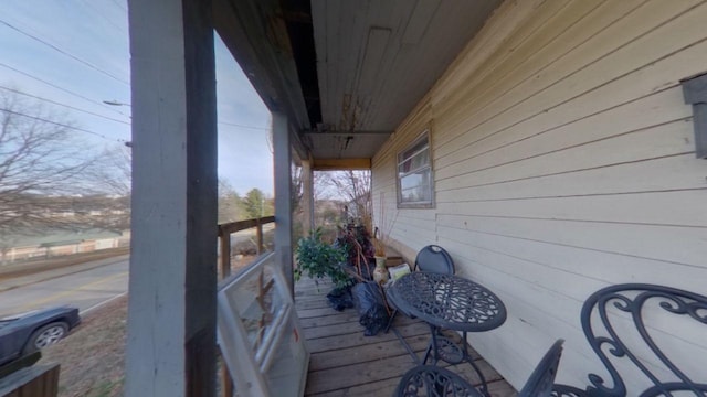 wooden terrace featuring a porch