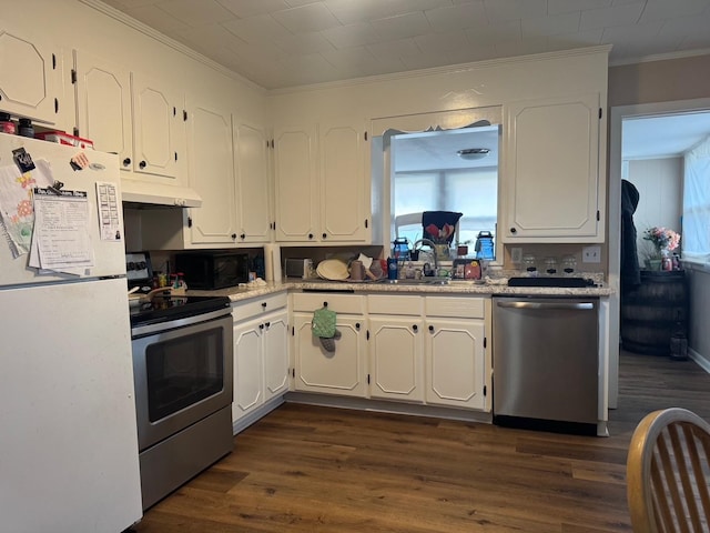 kitchen with stainless steel appliances, sink, white cabinets, and dark hardwood / wood-style floors