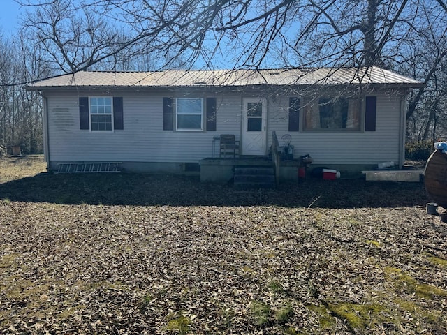 view of front of home featuring metal roof