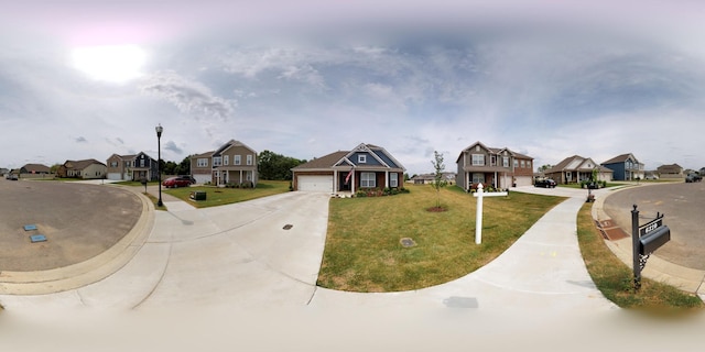 view of front of property featuring a garage and a front yard