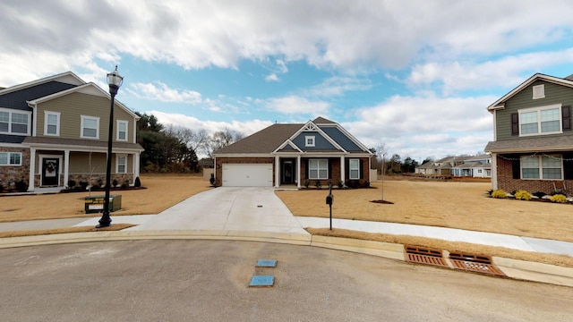 craftsman-style home with a garage and a front lawn