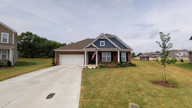 craftsman inspired home with a garage and a front yard