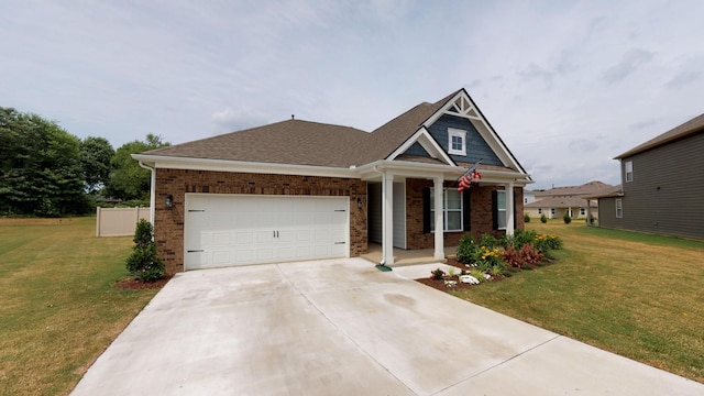 view of front of house featuring a garage and a front lawn