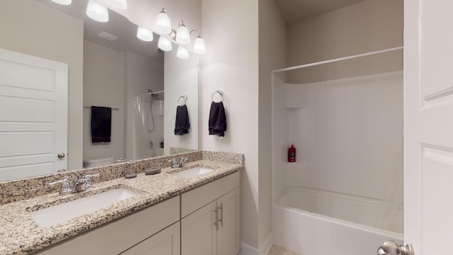 full bathroom featuring vanity, shower / bathing tub combination, and toilet