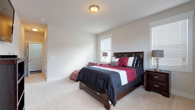 bedroom with light carpet