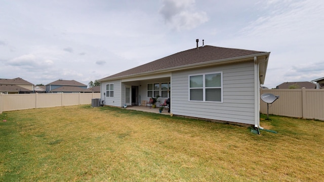 back of property featuring a yard, a patio, and central air condition unit