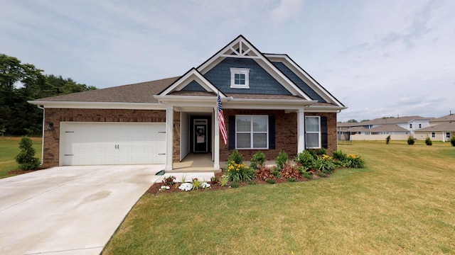 craftsman-style house featuring a garage and a front lawn