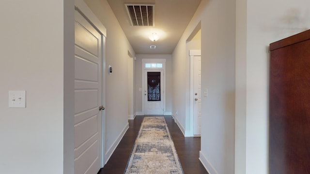 hall featuring dark wood-type flooring