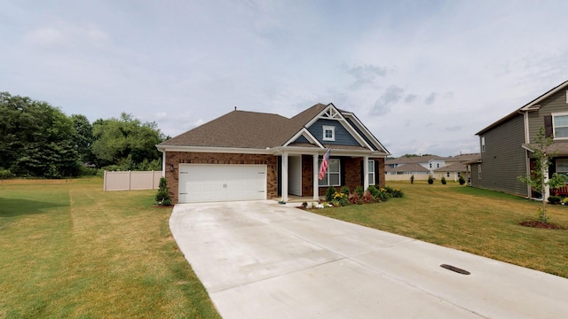 view of front of property with a garage and a front lawn