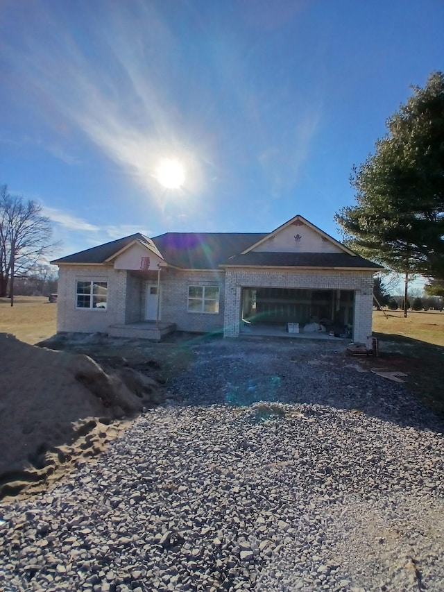 ranch-style home featuring a garage