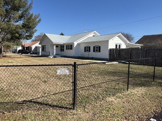 back of property featuring a yard