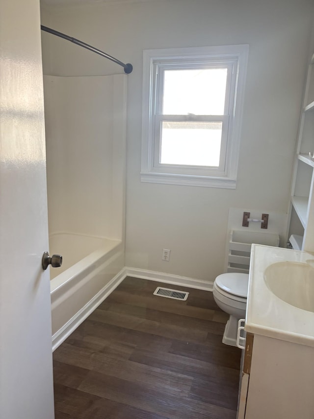 full bathroom featuring shower / bathtub combination, vanity, toilet, and hardwood / wood-style floors