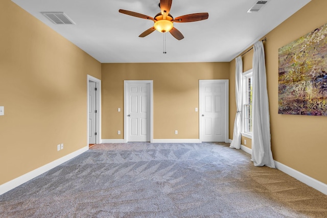 unfurnished bedroom with ceiling fan and carpet flooring