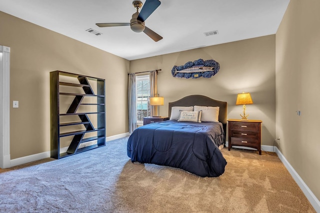 bedroom featuring light colored carpet and ceiling fan