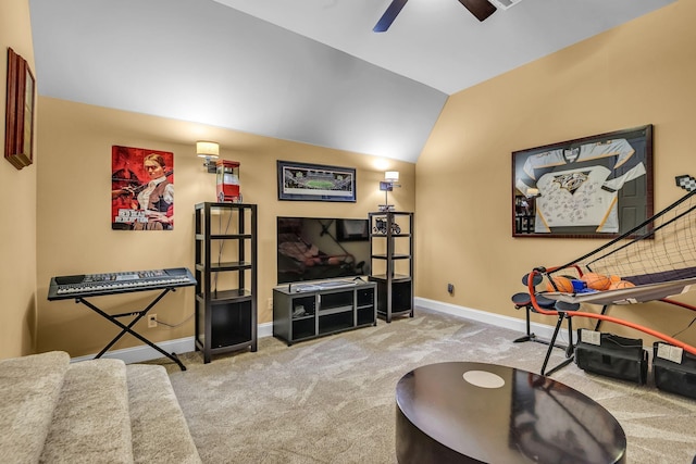 living room with ceiling fan, lofted ceiling, and light carpet