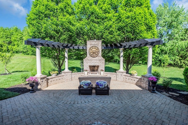 view of patio featuring an outdoor stone fireplace