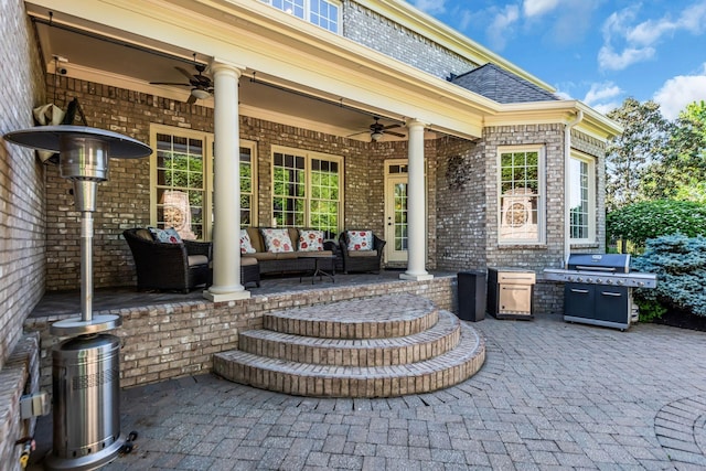 view of patio with area for grilling and an outdoor living space