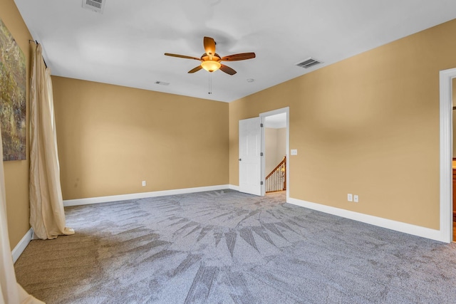 carpeted empty room with ceiling fan