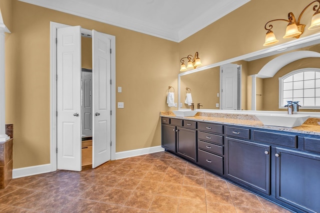 bathroom featuring a tub to relax in, tile patterned floors, ornamental molding, and vanity