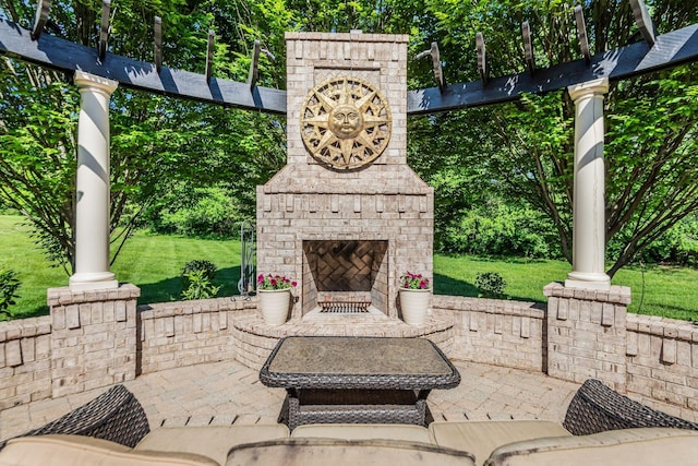 view of patio / terrace featuring an outdoor brick fireplace