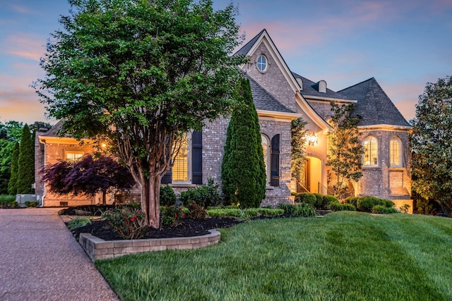 view of front of home with a yard