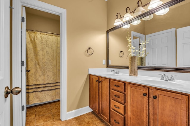 bathroom with tile patterned flooring and vanity