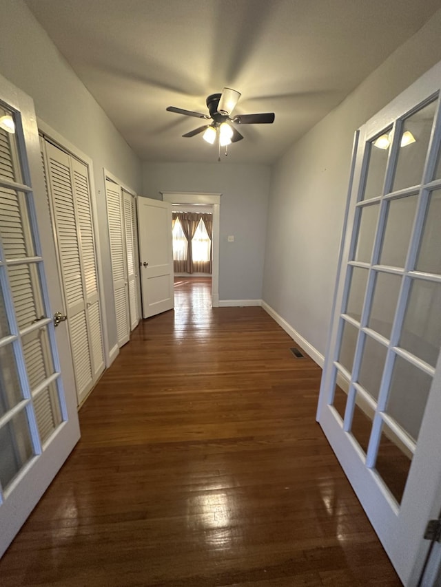 hallway with dark hardwood / wood-style floors