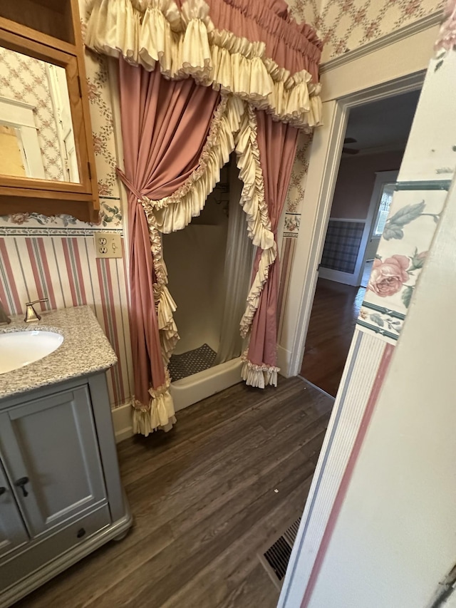 mudroom featuring sink and dark hardwood / wood-style flooring