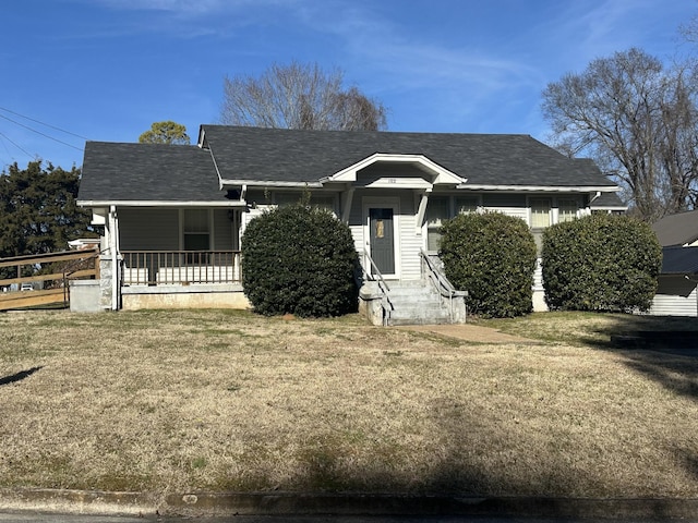 bungalow-style home featuring a front lawn and a porch