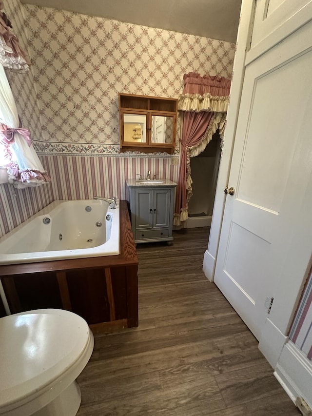 bathroom featuring hardwood / wood-style floors, sink, and a tub