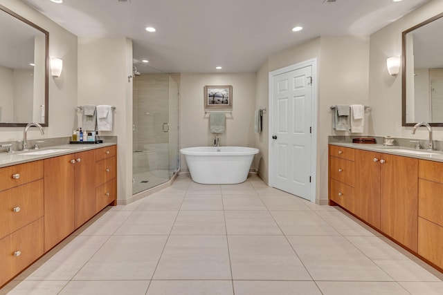 bathroom featuring tile patterned flooring, vanity, and independent shower and bath