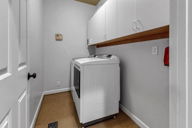 laundry room with cabinets and independent washer and dryer