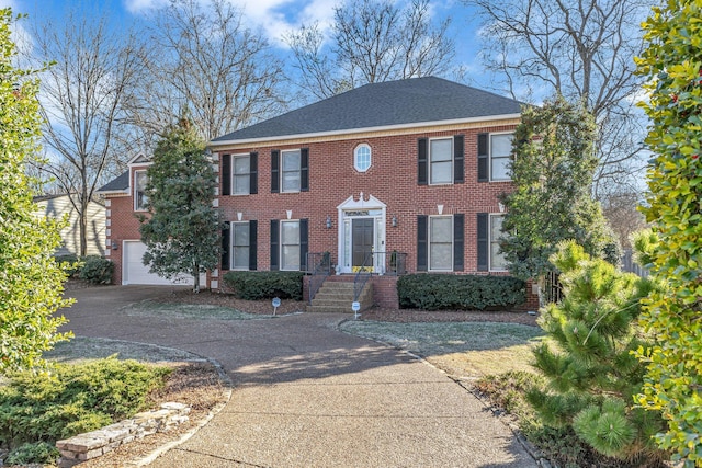 colonial-style house featuring a garage