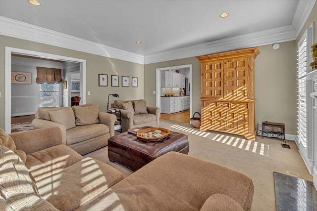 living room featuring crown molding, light colored carpet, and a premium fireplace