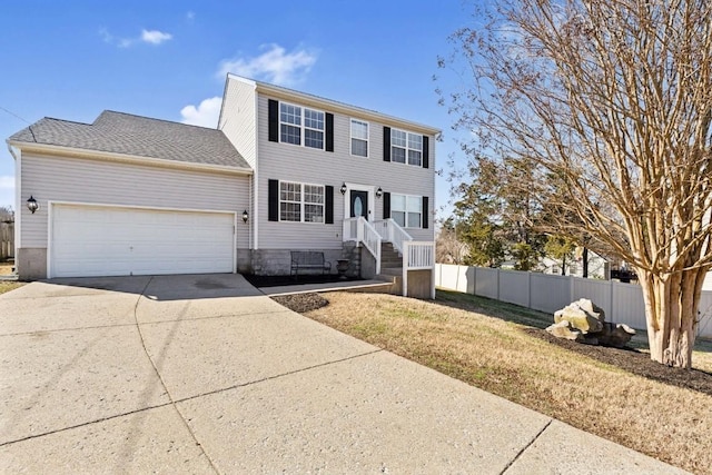 view of front facade featuring a garage and a front yard