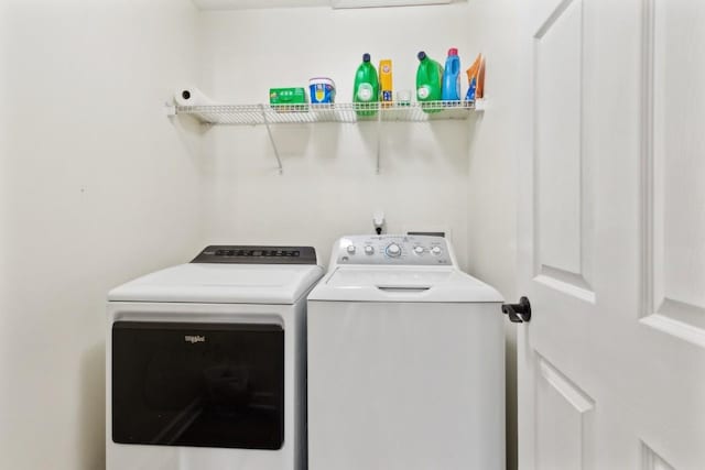 washroom featuring washer and clothes dryer