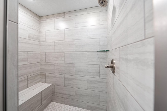 bathroom featuring tiled shower