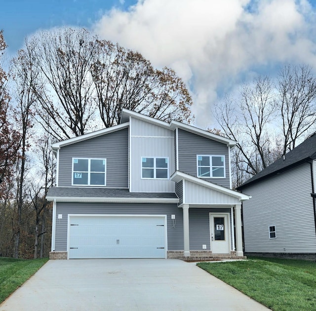 view of front facade featuring a garage and a front lawn