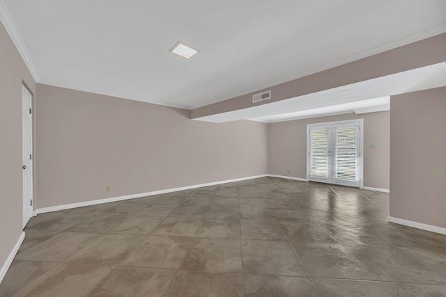 unfurnished room featuring ornamental molding and french doors