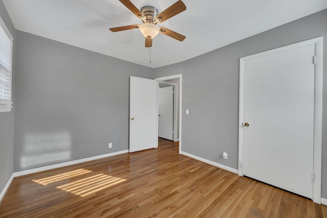 unfurnished bedroom featuring ceiling fan and light hardwood / wood-style floors