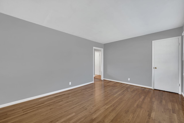 unfurnished room featuring hardwood / wood-style flooring